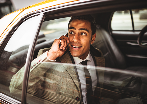 Man looking out car window